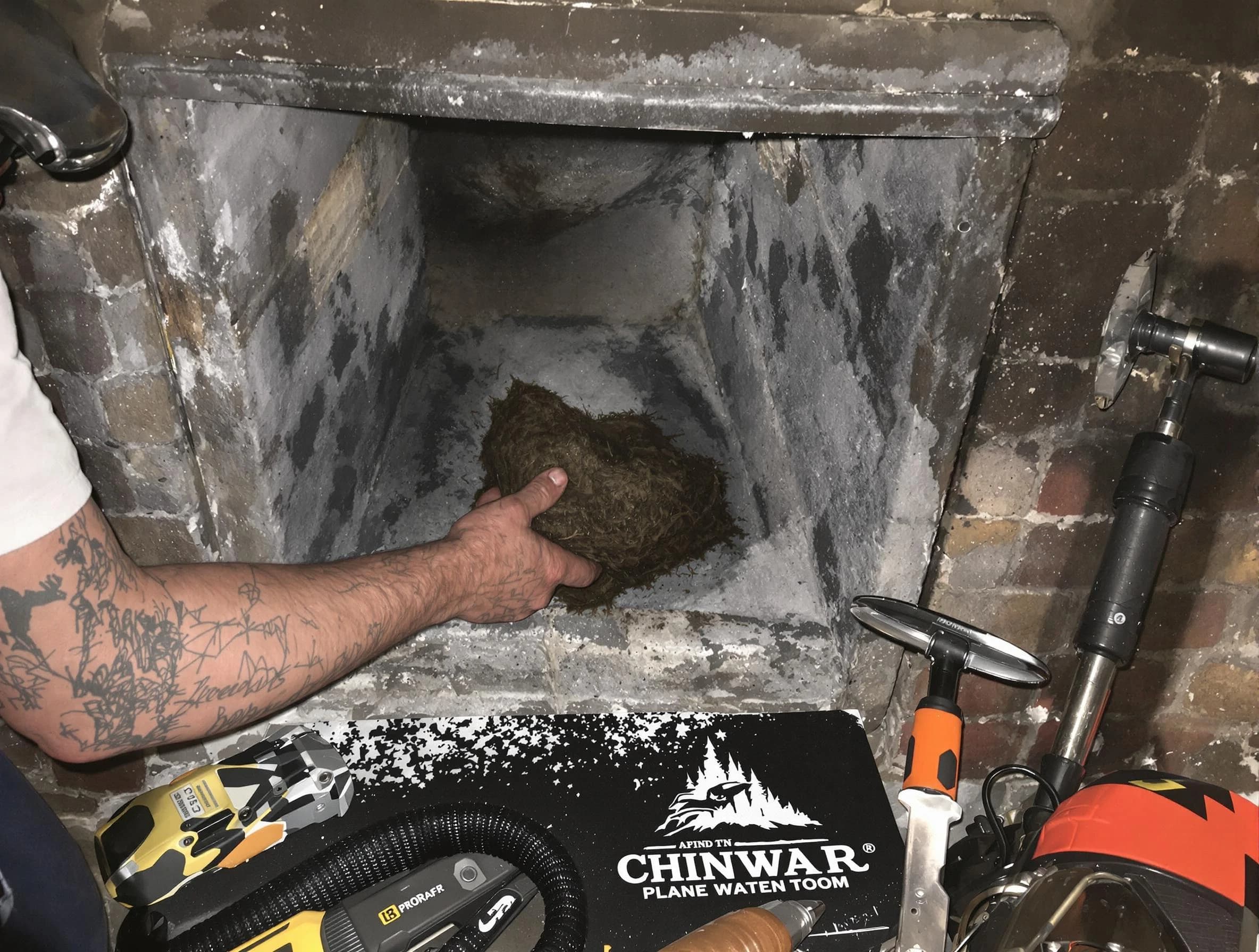 Forestdale Chimney Sweep safely removing debris and screening chimney in Forestdale, AL
